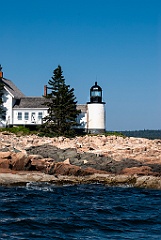 Winter Harbor Light Over Rocky Island Shoreline